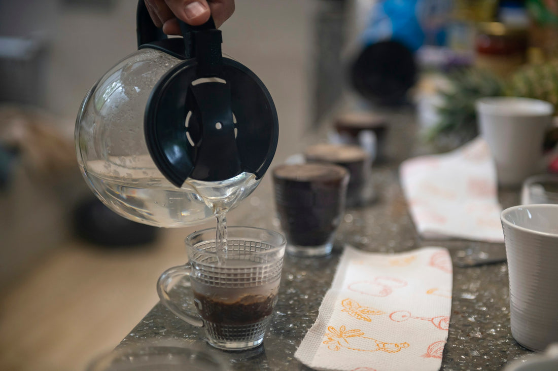 Coffee cupping setup with multiple brewed coffees used to compare acidity and flavor
